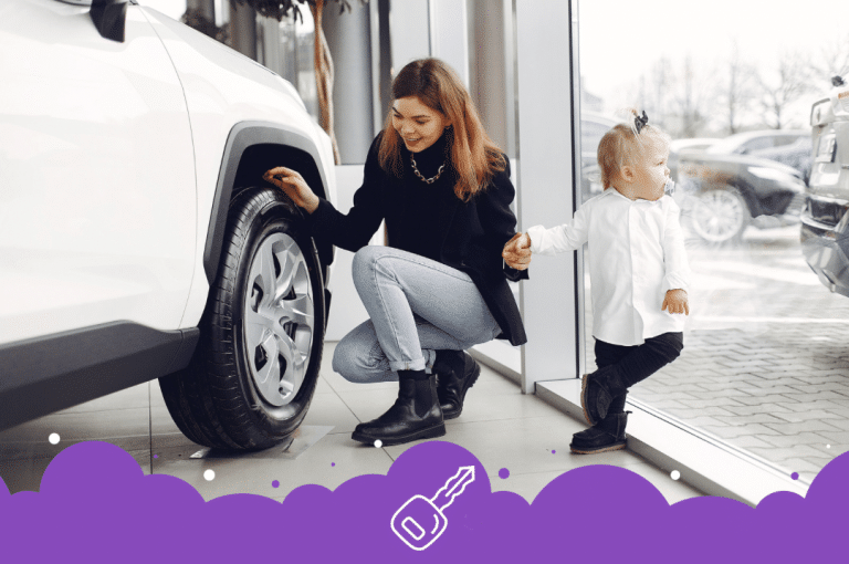 Single parent looking at new car with kid