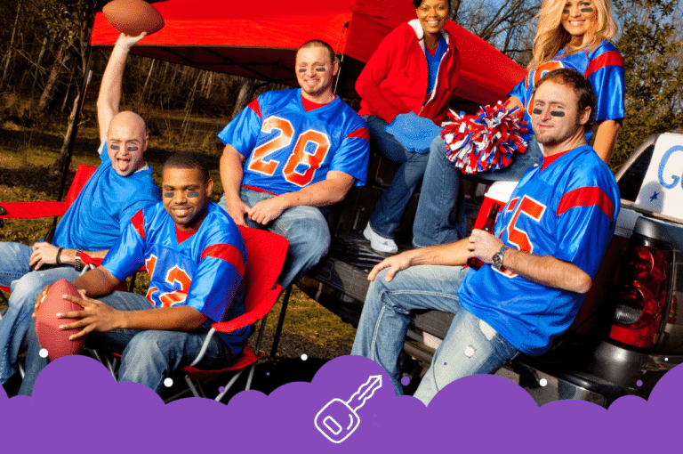 Sports fans in jerseys sitting on back of truck