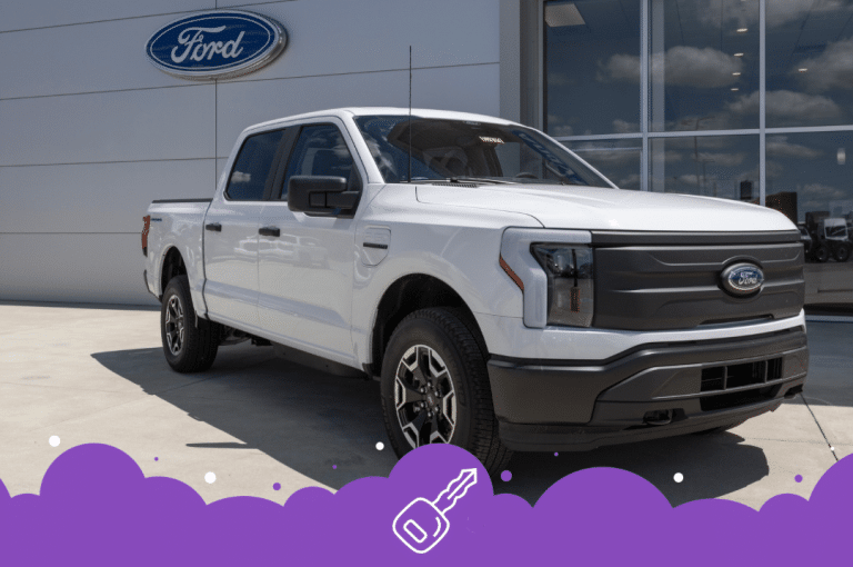 White ford lightning parked infront of dealer