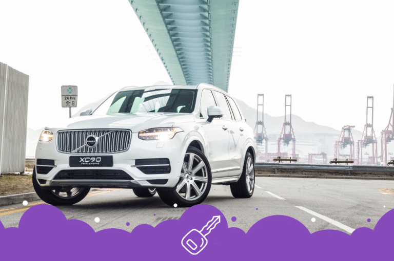 White Volvo xc90 parked under a bridge