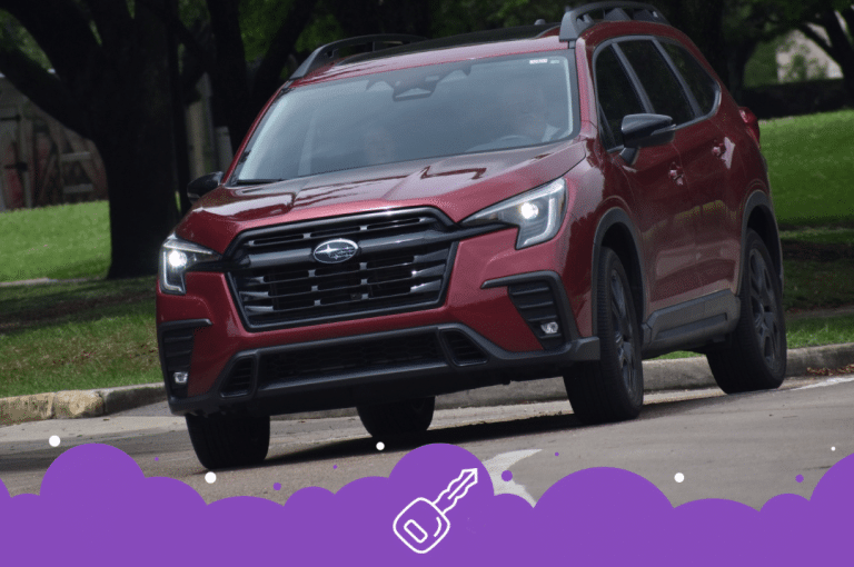 Burgundy Subaru ascent driving