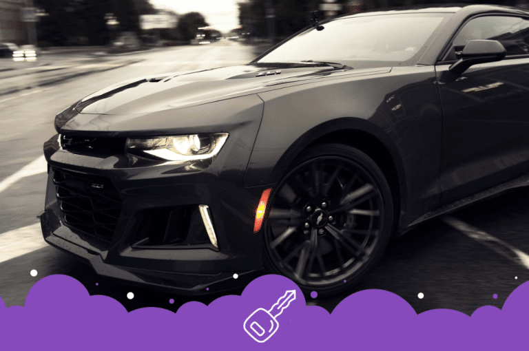 Black Chevy Camaro turning on street