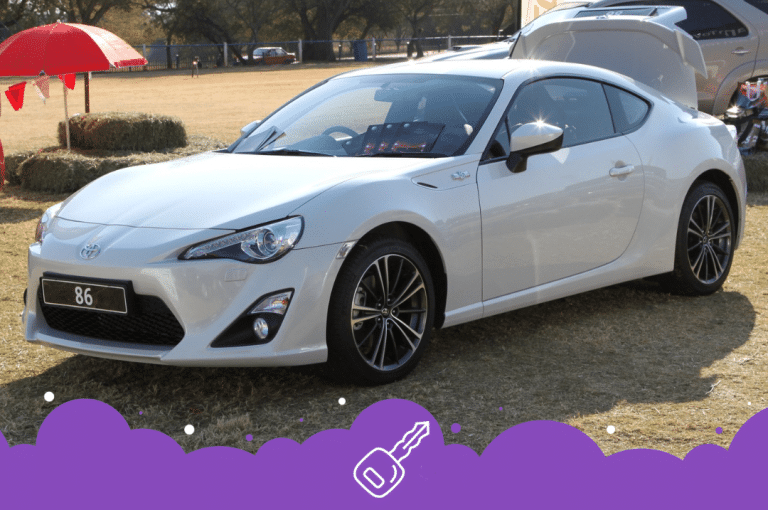 White Toyota 86 parked on grass