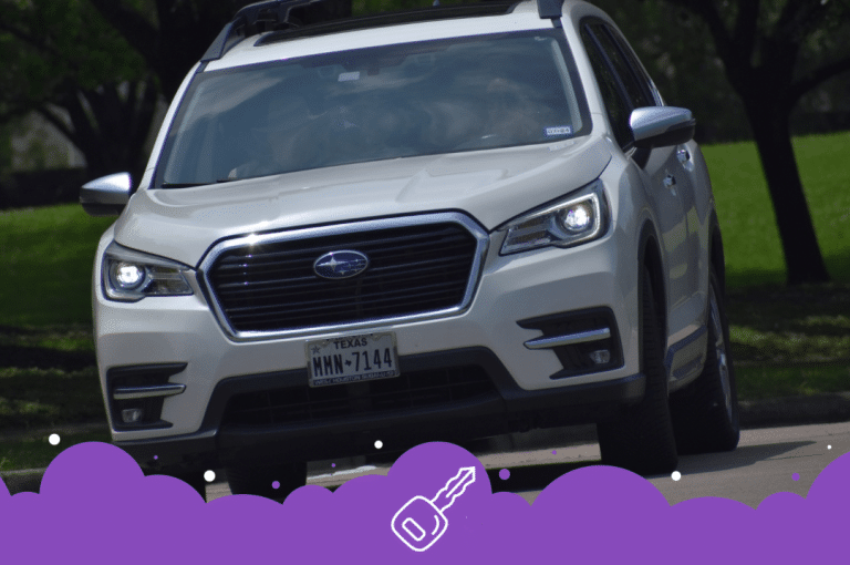 White Subaru ascent driving