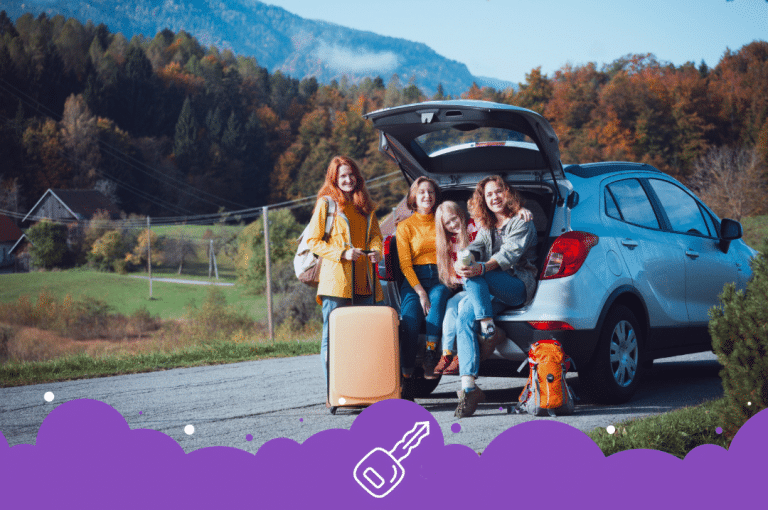 Happy travelling family sitting in back of car