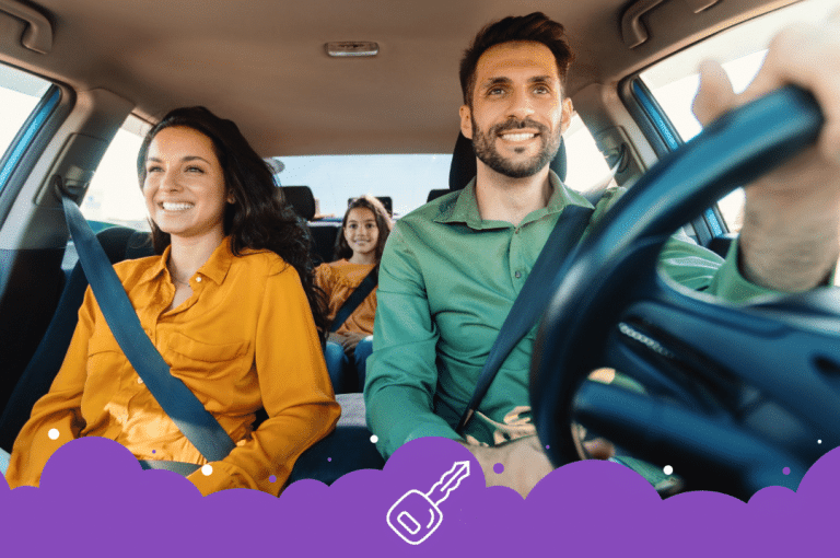 Happy family of 3 driving